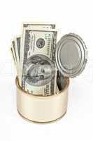 US dollars bills  in tin can over white background