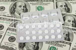 Costly Daily Medication on a money background