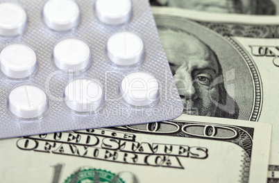 Costly Daily Medication on a money background