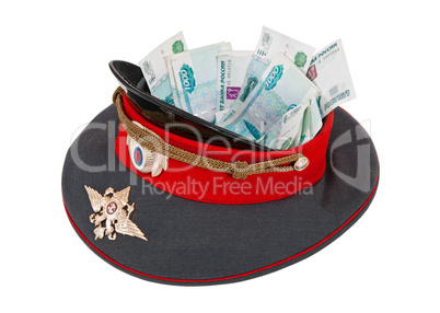 Police cap with money on  white background