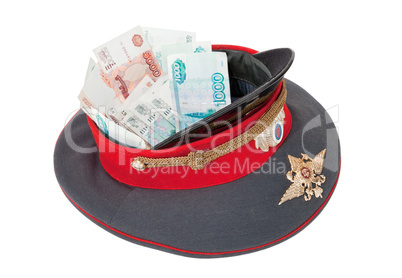 Police cap with money on white background