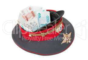 Police cap with money on white background