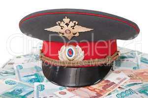 Police cap and money on white background