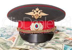 Police cap and money on white background