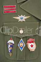 Russian military badges on green uniform