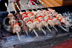 Juicy slices of meat with sauce prepare on fire (shish kebab).