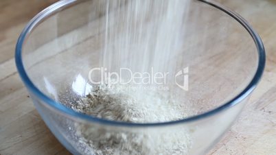 Pouring oats in a bowl