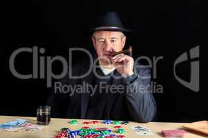Man with a cool look at poker