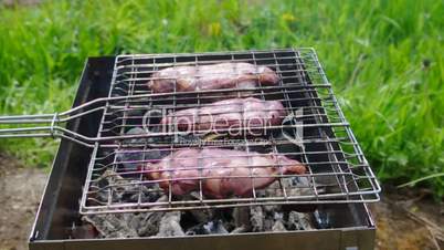 barbecue.chicken on the grill with flames