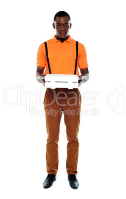 Full length portrait of delivery boy with pizza