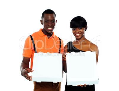 Beautiful young couple with pizza boxes