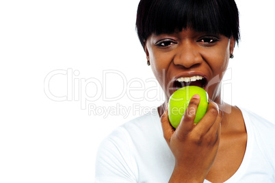 Close up shot pretty lady eating green apple