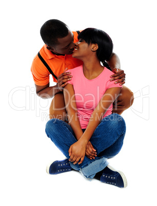 Smiling young couple about to kiss