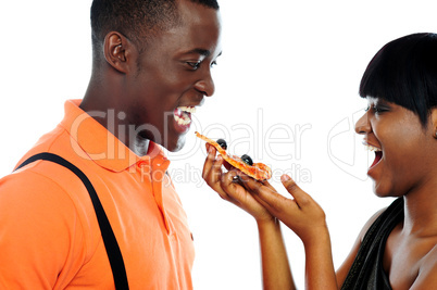 Gorgeous girl offering pizza slice