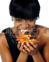 Woman enjoying pie of a pizza