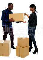 Couple moving empty cartons