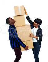 Teenage couple with cardboard boxes