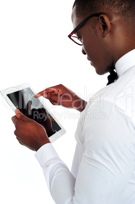 Rear-view of african holding a touch-pad device