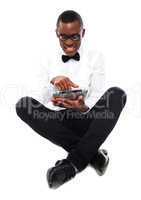 African boy watching video on tablet pc