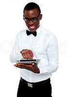 Smiling african boy using tablet-pc