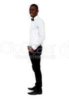 Full length view of smart young man. Side pose