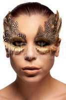 Woman wearing creative feather make-up