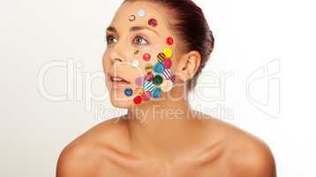 Woman with buttons on her face