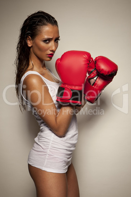 Sexy woman with red boxing gloves