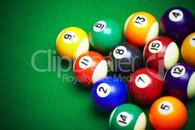 billiard balls on green cloth