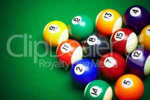 billiard balls on green cloth