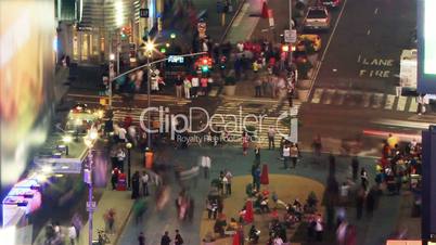 crowds crossing street at evening, time lapse and loopable