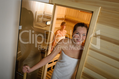 Woman posing at sauna in health spa