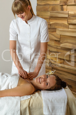 Woman and masseur at luxury spa room