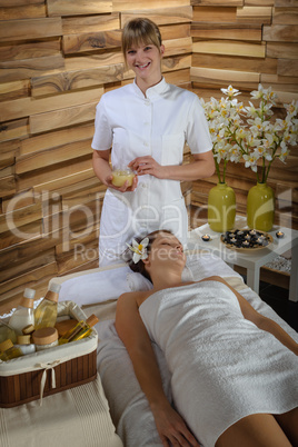 Woman and masseur at luxury spa room