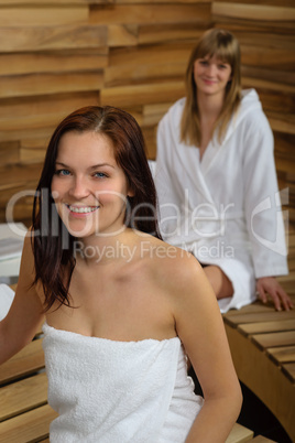 Woman at spa room wrapped in towel