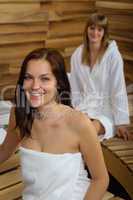 Woman at spa room wrapped in towel