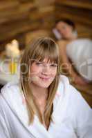 Woman in bathrobe at spa room
