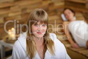 Woman in bathrobe at spa room