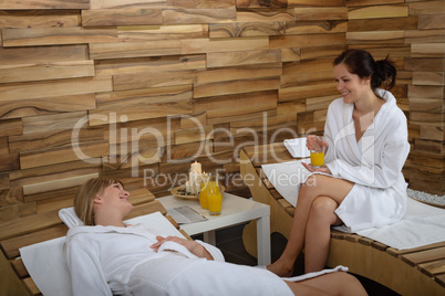 Spa treatment two women in bathrobe