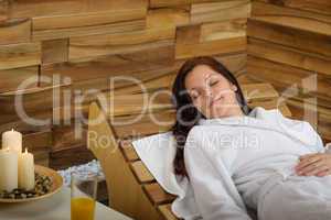 Relax spa woman lying on wooden chair