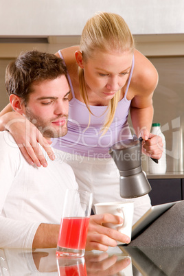 couple in kitchen having breakfast