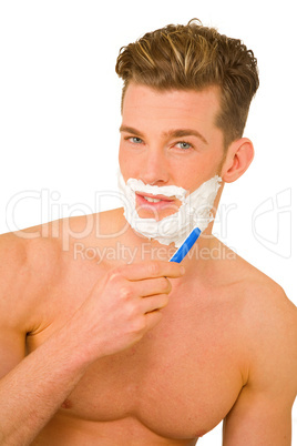 Young man shaving