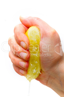 hand squeezing half lemon