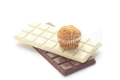 bar of chocolate and muffin isolated on white