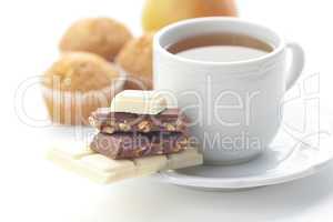 bar of chocolate,tea and muffin isolated on white