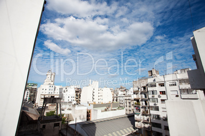 view of the city and the blue sky with clouds