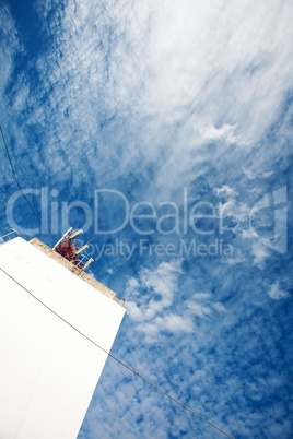 background of blue sky with clouds and the wall of the building