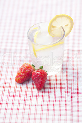 cocktail with ice, lemon and strawberry