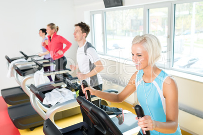 Young people on fitness treadmill running exercise