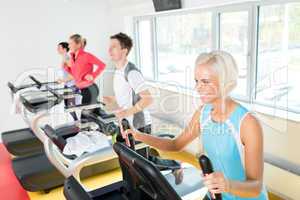 Young people on fitness treadmill running exercise